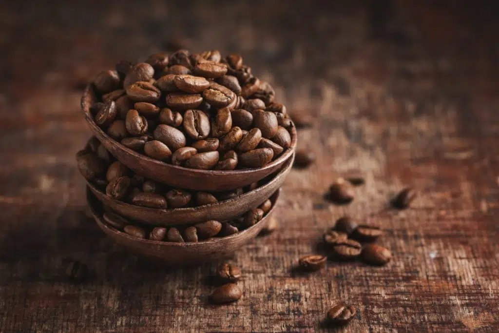 coffee beans in small bowls on wooden