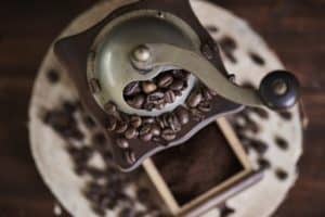 close up of coffee grinder and beans